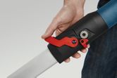 A person adjusts the red locking lever on a drywall sander handle.