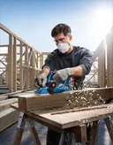 Bosch GHO 185-LI cordless planer smoothing wood.