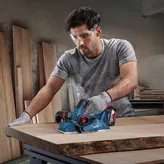Bosch GHO 18V planer used for smoothing wood.