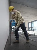 Bosch GBH 6-42 C rotary hammer drilling into concrete.
