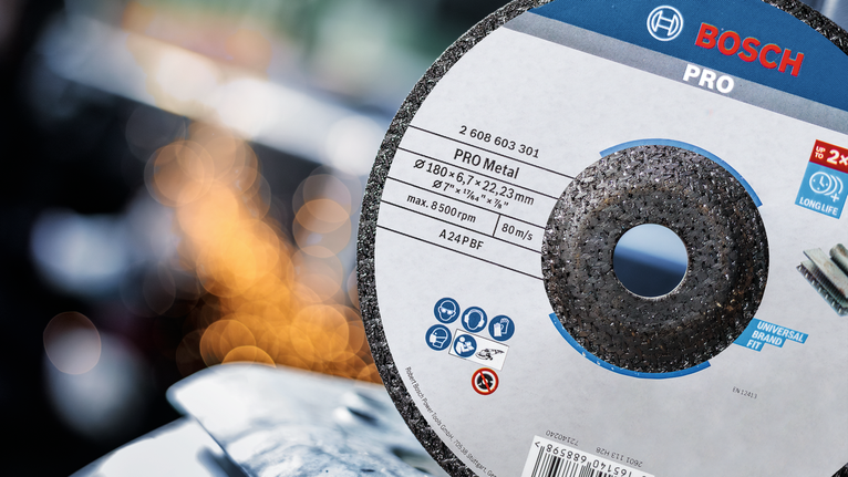 PRO Metal Grinding Disc, A 24 S BF, 180 x 6.6 x 22.23 mm, Depressed Centre Cutting disc positioned near metal with sparks in the background.