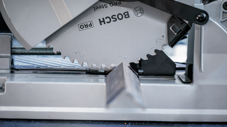 PRO Steel Circular Saw Blade, Corded, 254 x 2.2 x 25.4 mm, T52 Circular saw blade cutting through a metal beam at an angle.