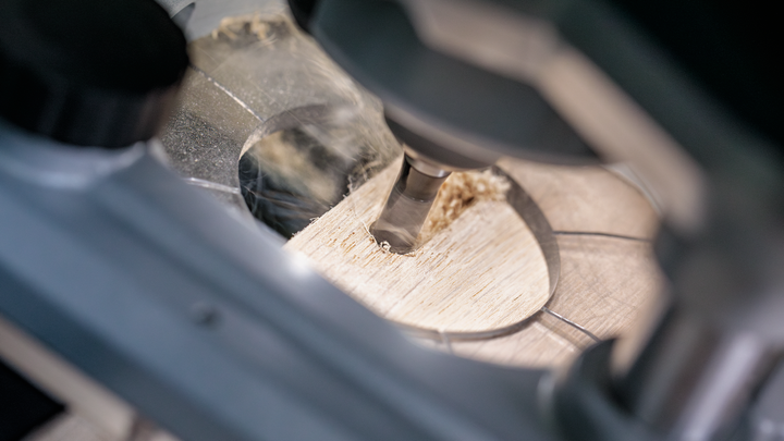 Object #200587644: 7437772_app_web_06 Rotary tool drilling a precise hole in a wooden board.