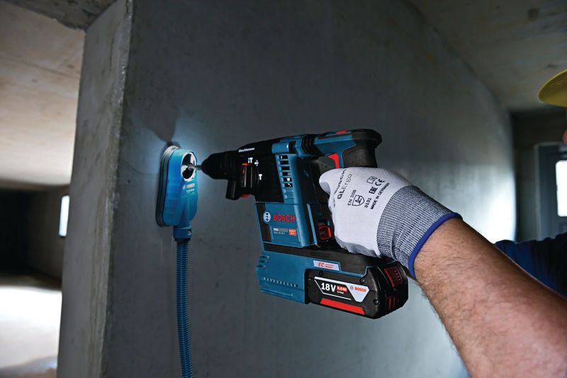 Bosch GBH 18V-26 F cordless rotary hammer in use.