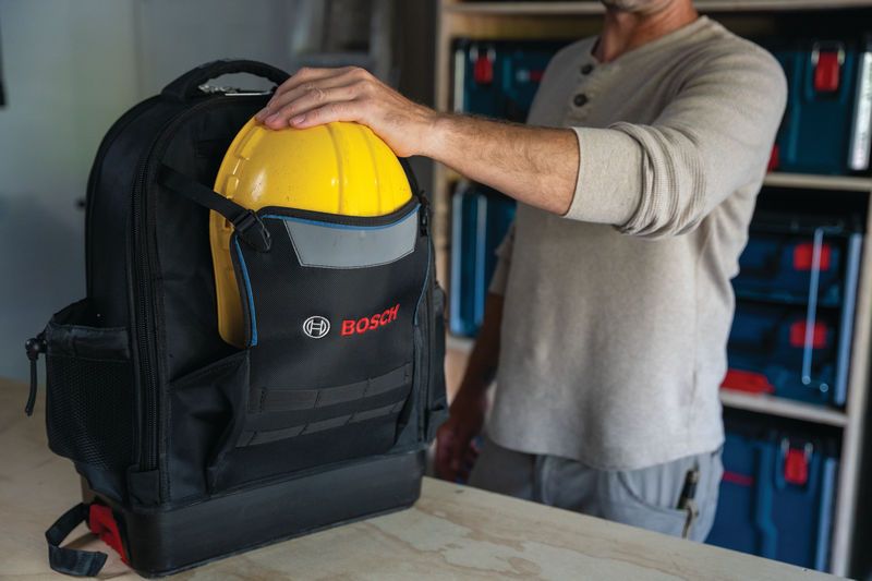 Bosch L-BOXX Contractor Backpack holding a yellow hard hat.