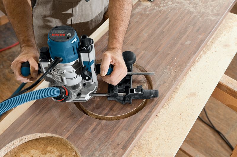 GOF 1600 CE A person uses a router to cut a circular hole in a wooden board.