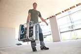 Man carrying table saw