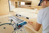 Man using table saw.